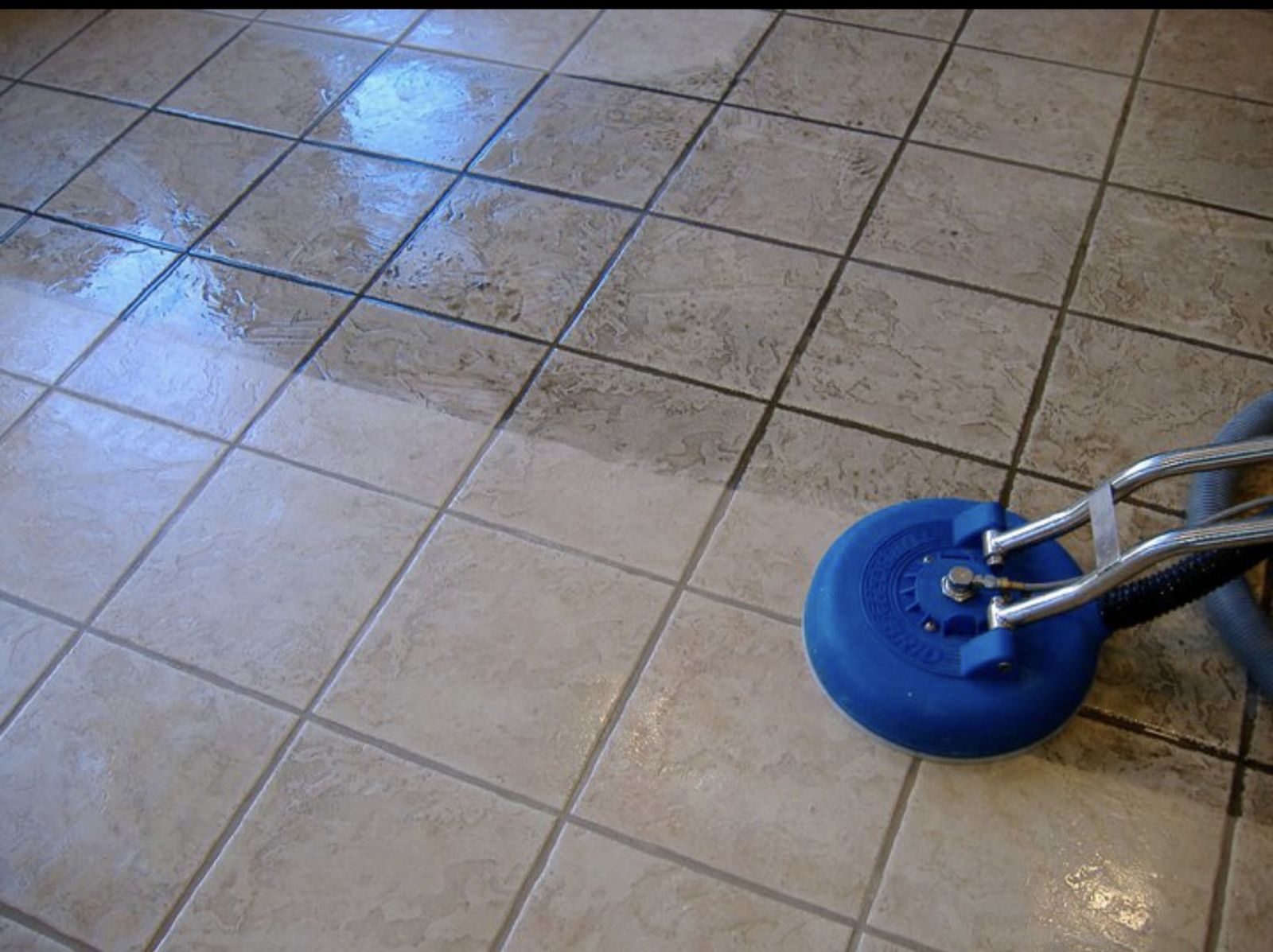 Ceramic tile and grout cleaning in progress