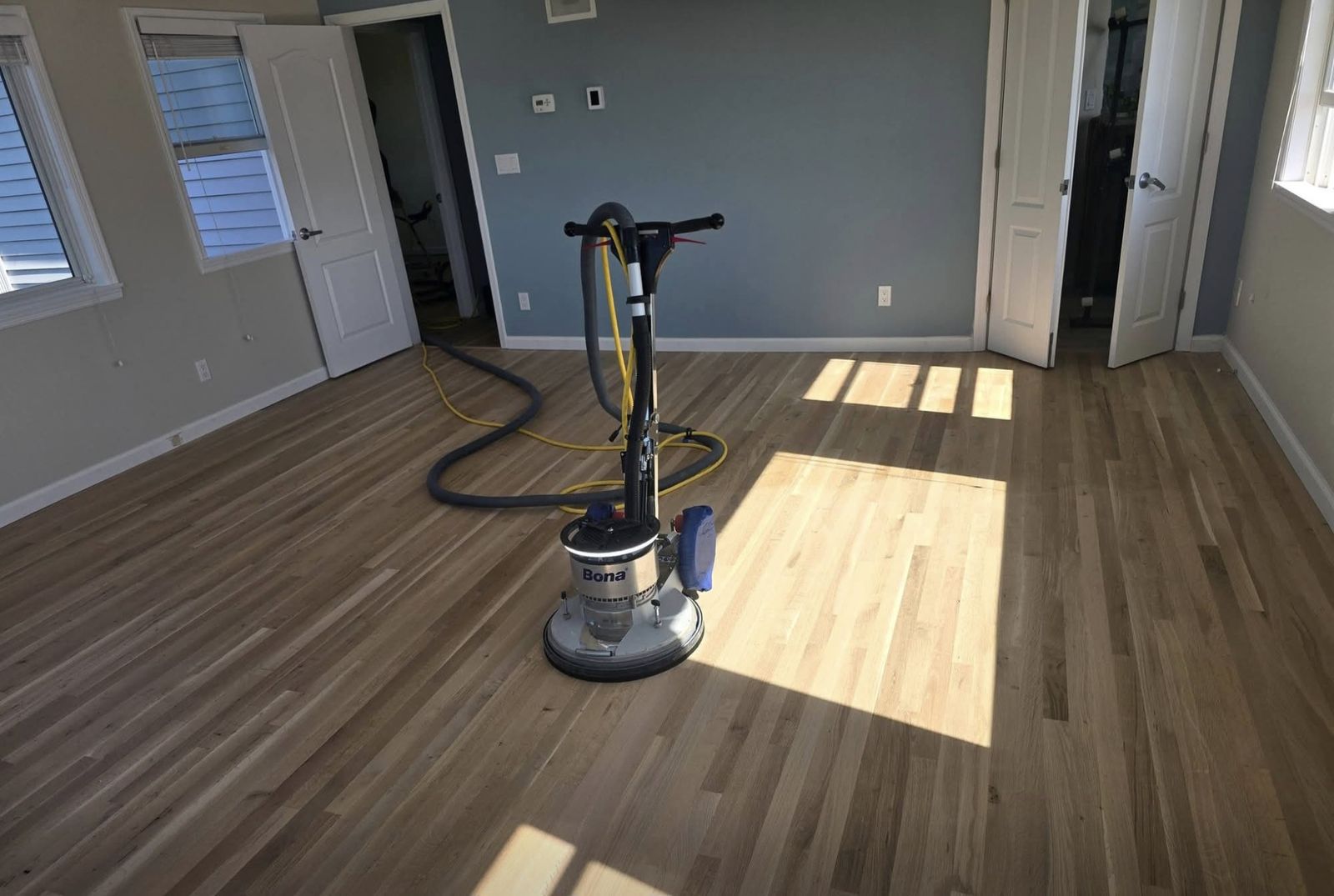 Hardwood floor refinishing in progress